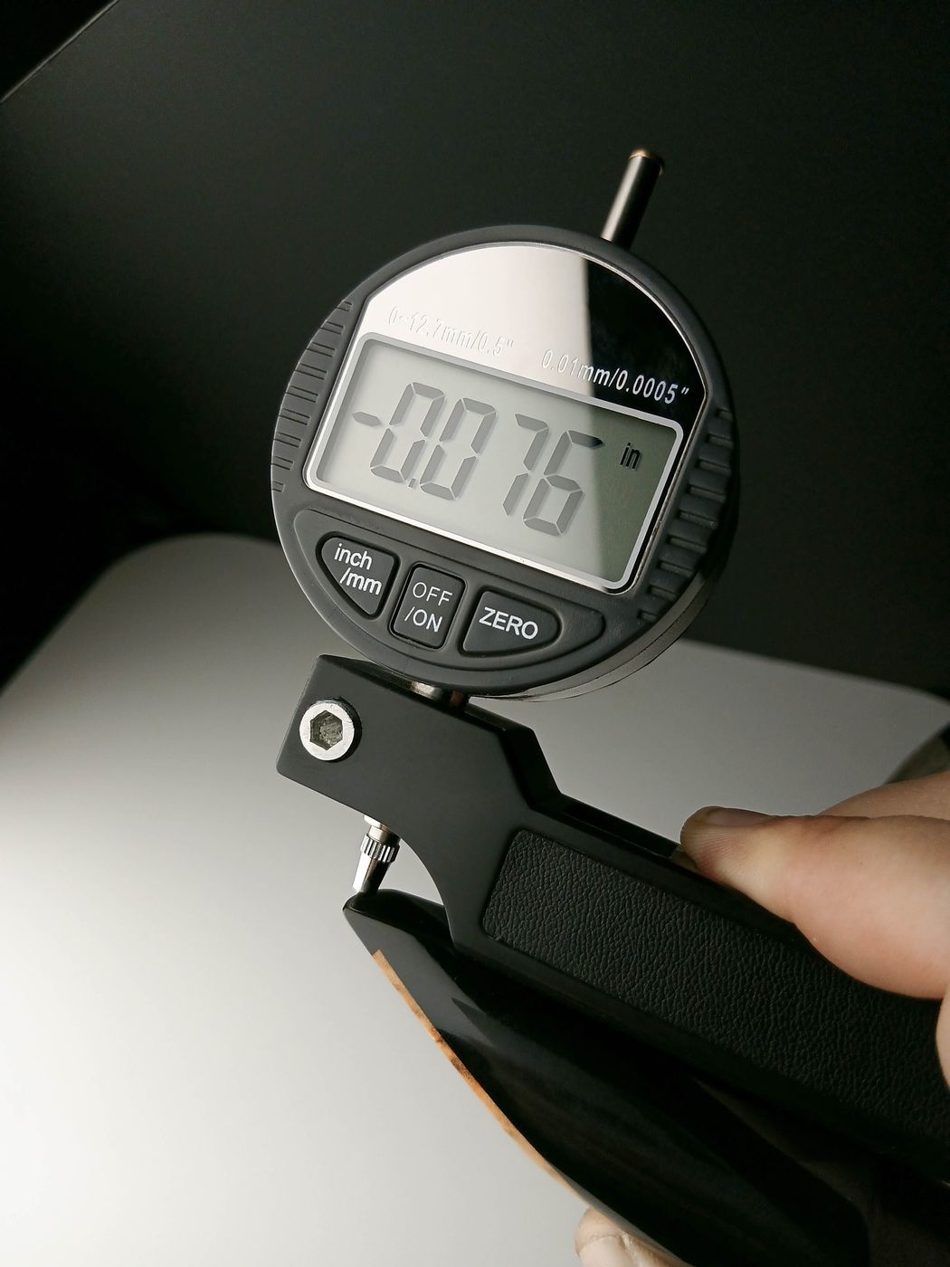 Digital indicator measuring a machined part to a tight tolerance during post-process inspection