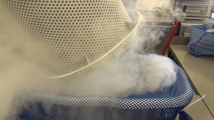 Liquid nitrogen vapor filling a Nitrofreeze cryogenic deburring basket during a validation run